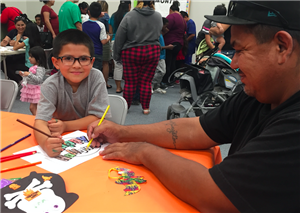 Families get creative at pumpkin night. 